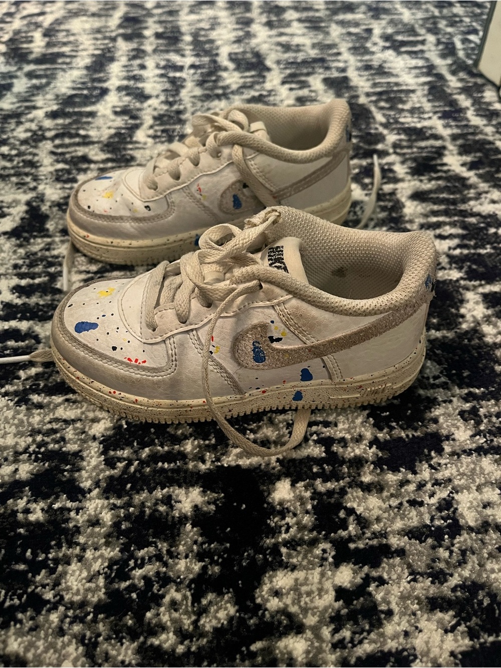 Nike Kids White Sneakers with Blue and Yellow Paint Splatters